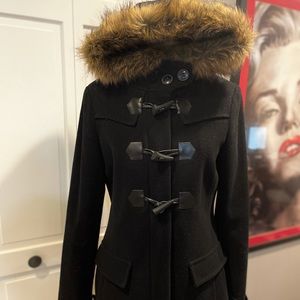 Black coat with toggle buttons and faux fur trim